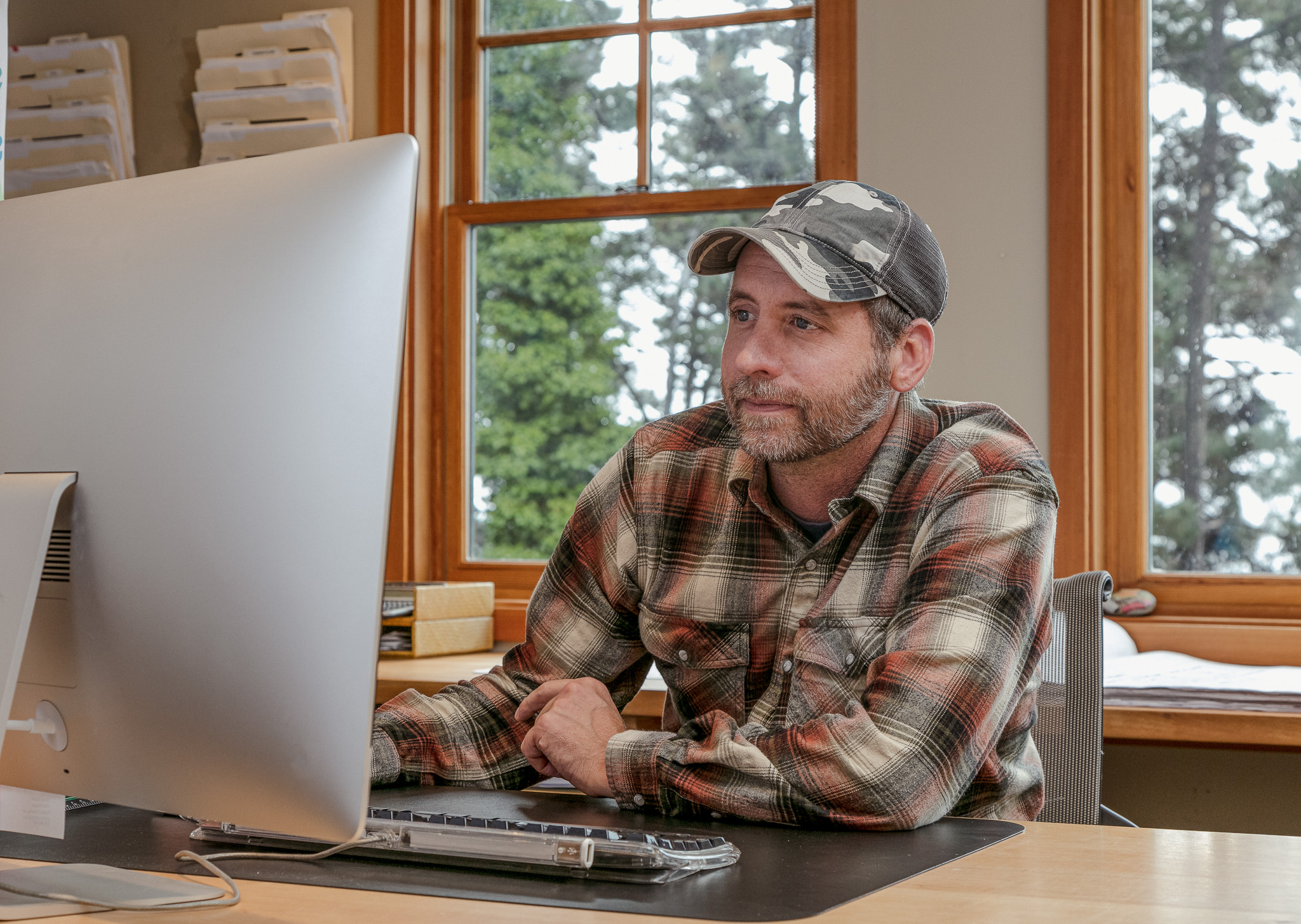 Farmer doing his payroll on his computer